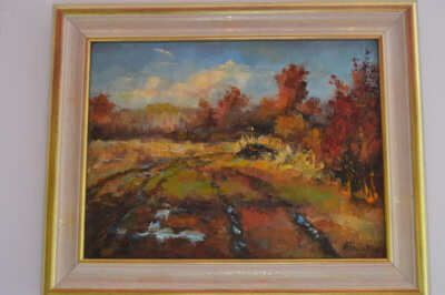 Obraz Henryka Filipczaka przedstawiający jesienne pole.